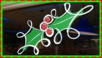 holly and berries painted on glass in vivid colors